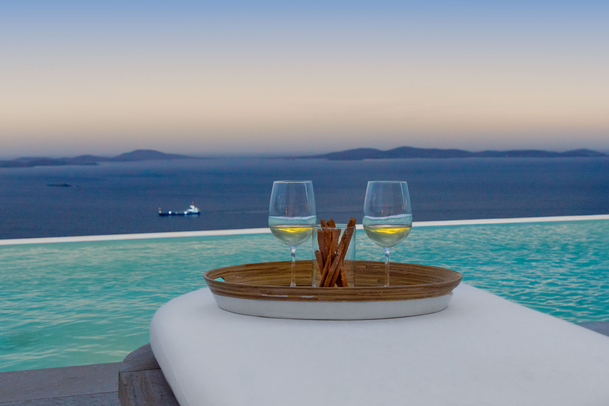 Wine at sunset by pool